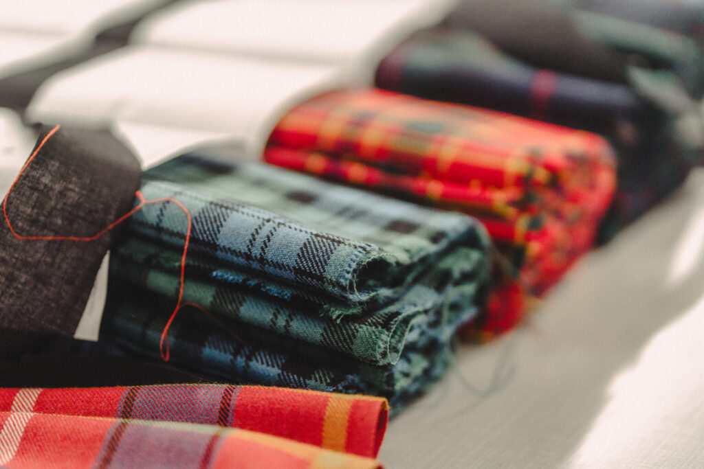 A Gaelic Themes tailor hand-finishing Highlandwear in the Glasgow workshop